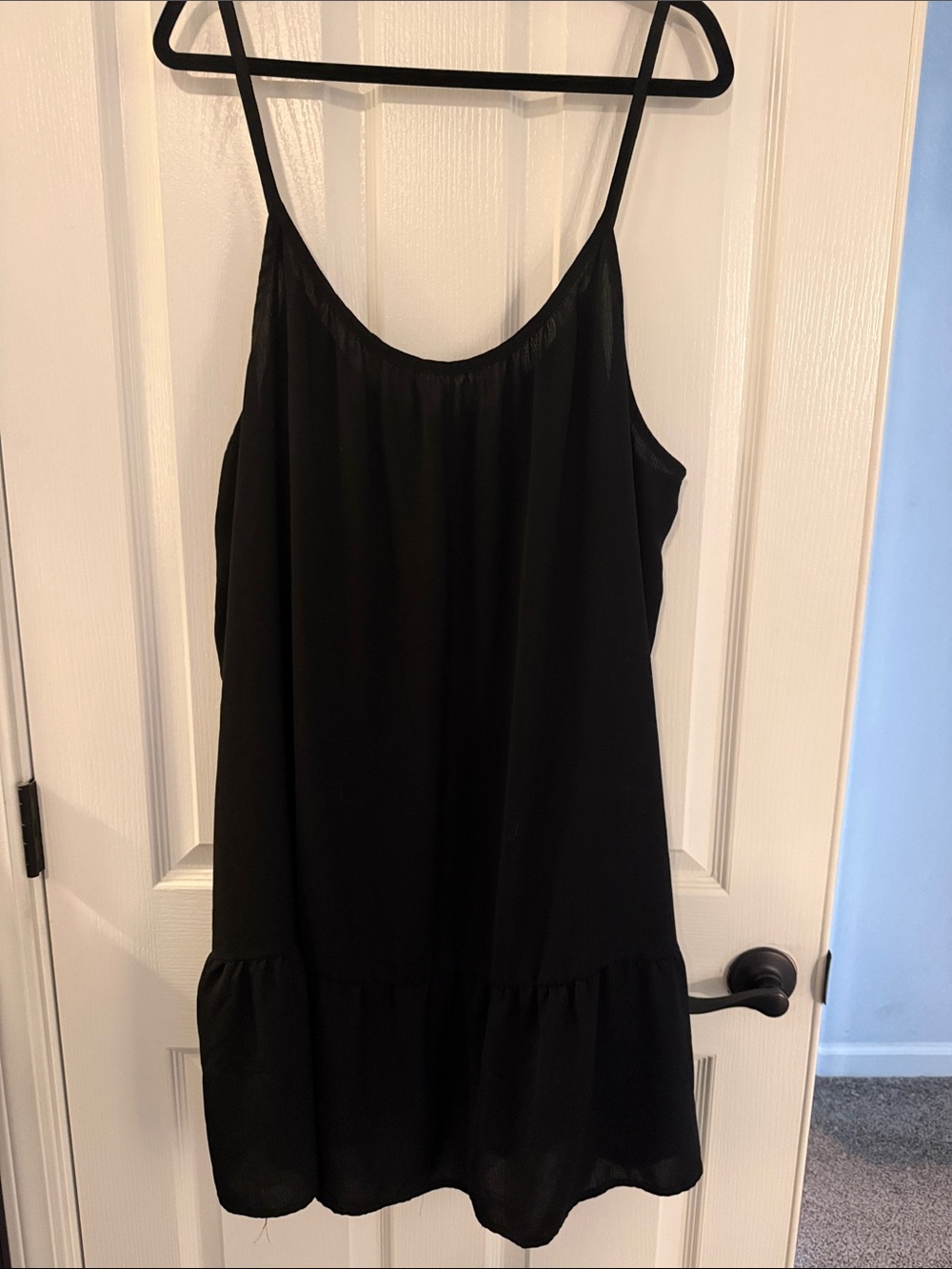 Swimsuit coverup with spaghetti straps.